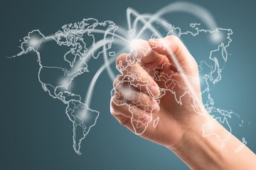 Businessman touching network around the world
